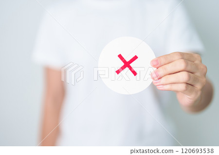 Woman show Wrong symbol paper. True and false, accept and rejected, evaluation, Vote, Poll, Yes or No and Survey concepts Woman show Wrong symbol paper. True and false, accept and rejected, evaluation, Vote, Poll, Yes or No and Survey concepts 120693538