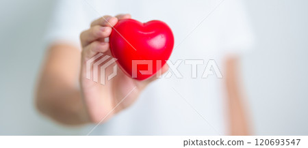 hand holding red heart shape in hospital. love, donor, world heart day, world health day, CSR donation and Insurance concepts 120693547