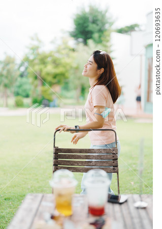 Happy woman with Dessert in cafe, young Asian girl smiling during eating cake and drinking ice beverage at home 120693635