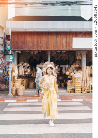Young asian woman traveler in dress with hat traveling to wicker shop on Chang Moi Kao Road, Tourist visit at the old city in Chang Mai, Thailand. Asia Travel, Vacation and summer holiday concept Young asian woman traveler in dress with hat traveling to wicker shop on Chang Moi Kao Road, Tourist visit at the old city in Chang Mai, Thailand. Asia Travel, Vacation and summer holiday concept 120693645
