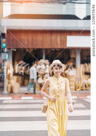 Young asian woman traveler in dress with hat traveling to wicker shop on Chang Moi Kao Road, Tourist visit at the old city in Chang Mai, Thailand. Asia Travel, Vacation and summer holiday concept Young asian woman traveler in dress with hat traveling to wicker shop on Chang Moi Kao Road, Tourist visit at the old city in Chang Mai, Thailand. Asia Travel, Vacation and summer holiday concept 120693646
