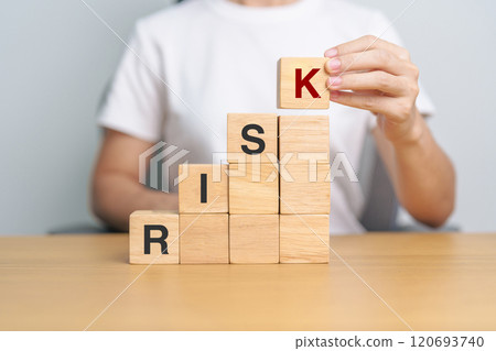 hand placing or pulling wooden block on the building. Business planning, Risk Management, Solution and strategy Concepts 120693740