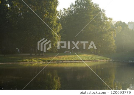 A Tranquil Morning at the Park with Beautiful Reflections on the Water Surface and Surroundings A Tranquil Morning at the Park with Beautiful Reflections on the Water Surface and Surroundings 120693779