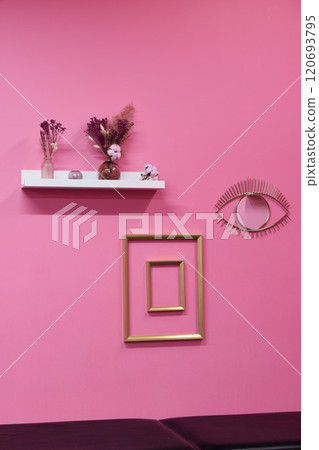 Chic and Stylish Pink Wall Decor Featuring Beautiful Shelves and Unique Artistic Art Pieces 120693795