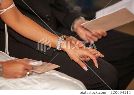 The beautiful act of intimate handholding during a heartfelt ceremony is truly special The beautiful act of intimate handholding during a heartfelt ceremony is truly special 120694113