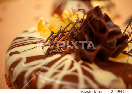 Indulge in a Delicious Chocolate Cake adorned with Elegant Decoration for every occasion Indulge in a Delicious Chocolate Cake adorned with Elegant Decoration for every occasion 120694114