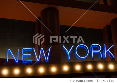 The Bright Neon Sign of New York City shines at Night, creating a stunning spectacle The Bright Neon Sign of New York City shines at Night, creating a stunning spectacle 120694149