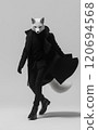 White fox posing in a black outfit 120694568