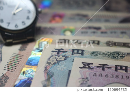 Watch and money 120694785