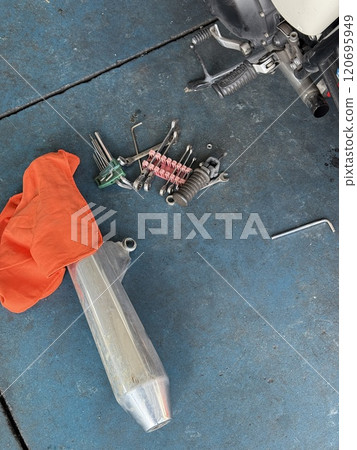 Removed motorcycle muffler 120695949