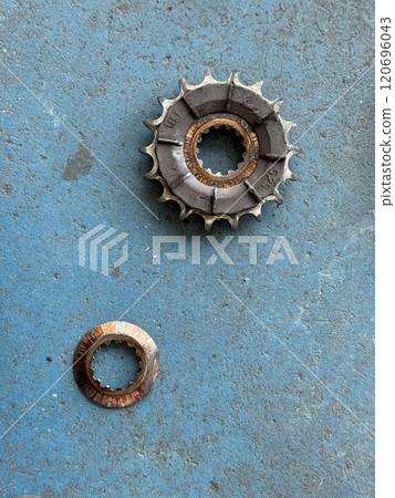 Dirty and worn motorcycle sprocket 120696043