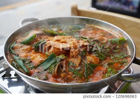 korean spicy stew made by boiling fish and vegetables with red pepper paste korean spicy stew made by boiling fish and vegetables with red pepper paste 120696063