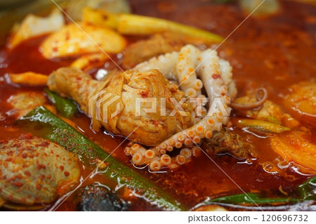 Spicy Korean stew with chicken and octopus 120696732
