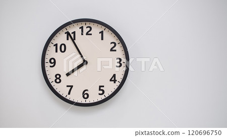 Classic Black-Edged Clock on White Background at 19.55/07.55 - Perfect for Time Management and Text Space Classic Black-Edged Clock on White Background at 19.55/07.55 - Perfect for Time Management and Text Space 120696750