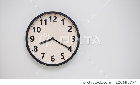 Classic Black-Edged Clock on White Background at 20.20/08.20 - Perfect for Time Management and Text Space 120696754