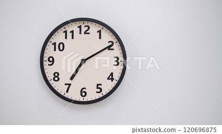 Classic Black-Edged Clock on White Background at 19.10/07.10 - Perfect for Time Management and Text Space Classic Black-Edged Clock on White Background at 19.10/07.10 - Perfect for Time Management and Text Space 120696875