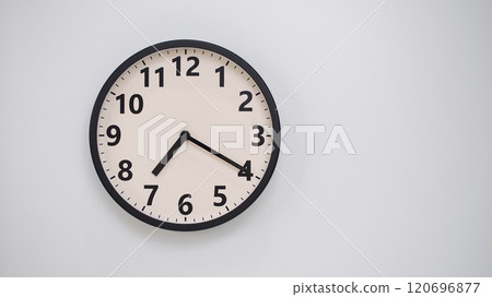 Classic Black-Edged Clock on White Background at 19.40/07.40 - Perfect for Time Management and Text Space Classic Black-Edged Clock on White Background at 19.40/07.40 - Perfect for Time Management and Text Space 120696877