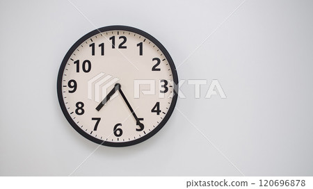 Classic Black-Edged Clock on White Background at 19.25/07.25 - Perfect for Time Management and Text Space Classic Black-Edged Clock on White Background at 19.25/07.25 - Perfect for Time Management and Text Space 120696878
