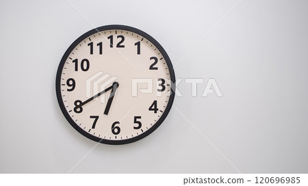 Classic Black-Edged Clock on White Background at 18.40/06.40 - Perfect for Time Management and Text Space Classic Black-Edged Clock on White Background at 18.40/06.40 - Perfect for Time Management and Text Space 120696985