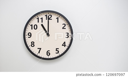 Classic Black-Edged Clock on White Background at 11.00/23.00 - Perfect for Time Management and Text Space Classic Black-Edged Clock on White Background at 11.00/23.00 - Perfect for Time Management and Text Space 120697097