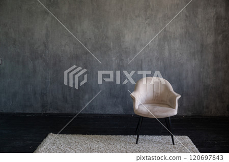one old vintage chair in the interior of a dark room one old vintage chair in the interior of a dark room 120697843