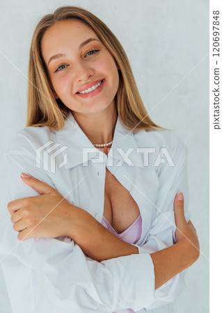 Beautiful woman with blue eyes smiling on white background Beautiful woman with blue eyes smiling on white background 120697848