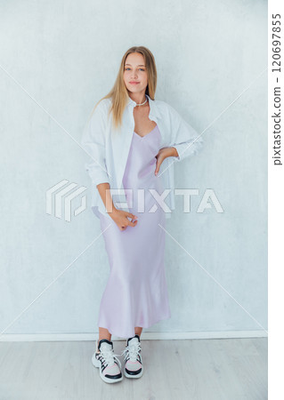 Beautiful slim fashion blonde woman in summer silk dress 120697855