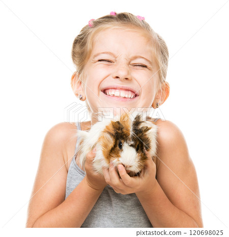 Cute little girl holding a guinea pig. Isolated on white background. 120698025