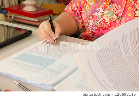 hand holding pencil over bubble proofreading paper 120698110