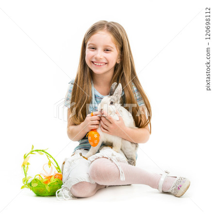 smiling little girl with Easter bunny on white 120698112