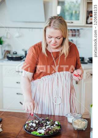 Woman Cook, Housewife Preparing Food for Dinner in Kitchen Woman Cook, Housewife Preparing Food for Dinner in Kitchen 120698135