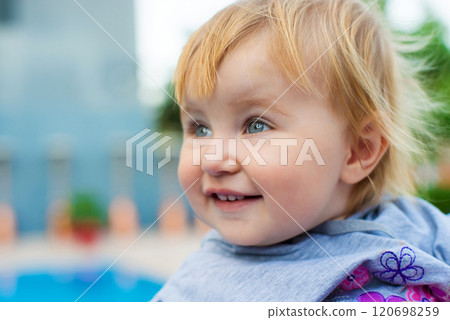 face cute little baby in the park face cute little baby in the park 120698259