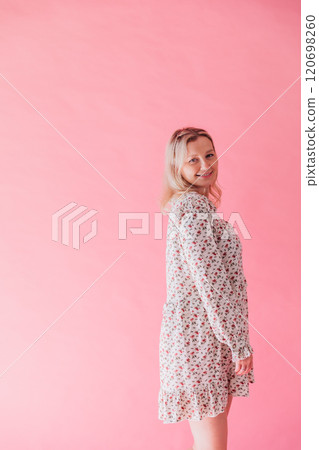 Beautiful woman in summer dress smiling 120698260