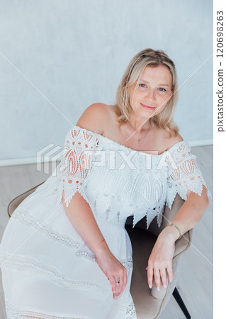 Beautiful woman in summer dress smiling Beautiful woman in summer dress smiling 120698263