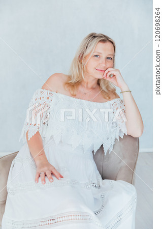 Beautiful blonde woman in summer white wedding dress Beautiful blonde woman in summer white wedding dress 120698264