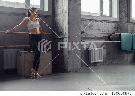 Passionate Fitness Enthusiast Committed to Achieving Goals in a Modern Gym Setting Passionate Fitness Enthusiast Committed to Achieving Goals in a Modern Gym Setting 120698972