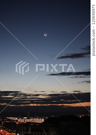 Earthlit crescent moon in the pre-sunrise sky Earthlit crescent moon in the pre-sunrise sky 120698975