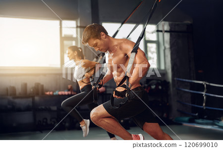 Dynamic and Effective Workout with Suspension Training in a Modern Gym Environment Today 120699010