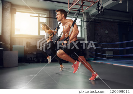 Experience Dynamic Fitness Training in the Gym with TRX Suspension Straps for all levels Experience Dynamic Fitness Training in the Gym with TRX Suspension Straps for all levels 120699011