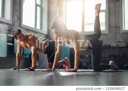 Engaging Dynamic Fitness Training Session Held in a StateoftheArt Modern Gym Facility 120699027