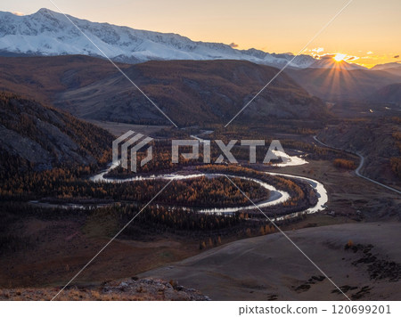 Twilight in a mountain valley with a twisty river. Twilight in a mountain valley with a twisty river. 120699201