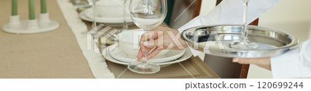 Preparing Elegant Table Setting for Event Preparing Elegant Table Setting for Event 120699244