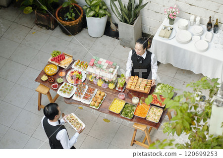Outdoor Catering Event with Diverse Food Selection 120699253