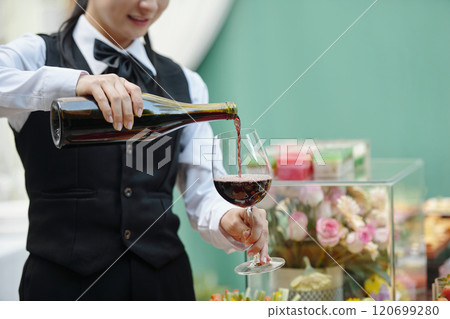 Sommelier Pouring Wine at Elegant Event 120699280