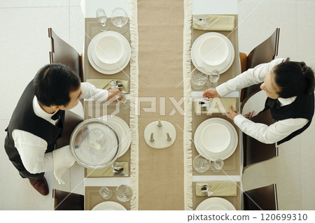 Setting Table for Fine Dining Experience 120699310