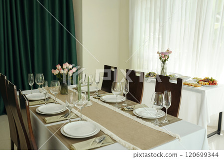 Dining Table Setting with Flowers and Tableware 120699344