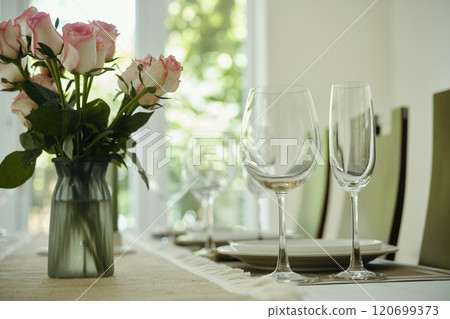 Dining Table Setting with Roses and Glasses Dining Table Setting with Roses and Glasses 120699373