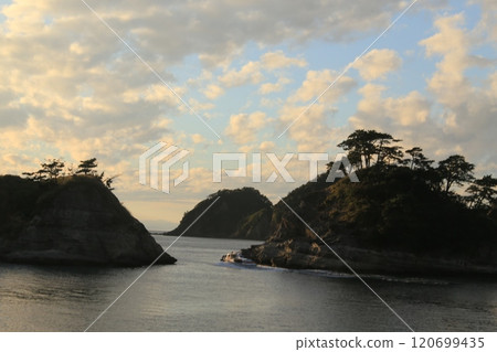 A beautiful sunset seen beyond Dogashima 120699435