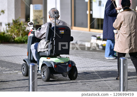 Yokohama cityscape in Japan, aging society, elderly people in electric carts = Yokohama city Yokohama cityscape in Japan, aging society, elderly people in electric carts = Yokohama city 120699459