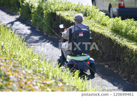 Yokohama cityscape in Japan, aging society, elderly people in electric carts = Yokohama city Yokohama cityscape in Japan, aging society, elderly people in electric carts = Yokohama city 120699461